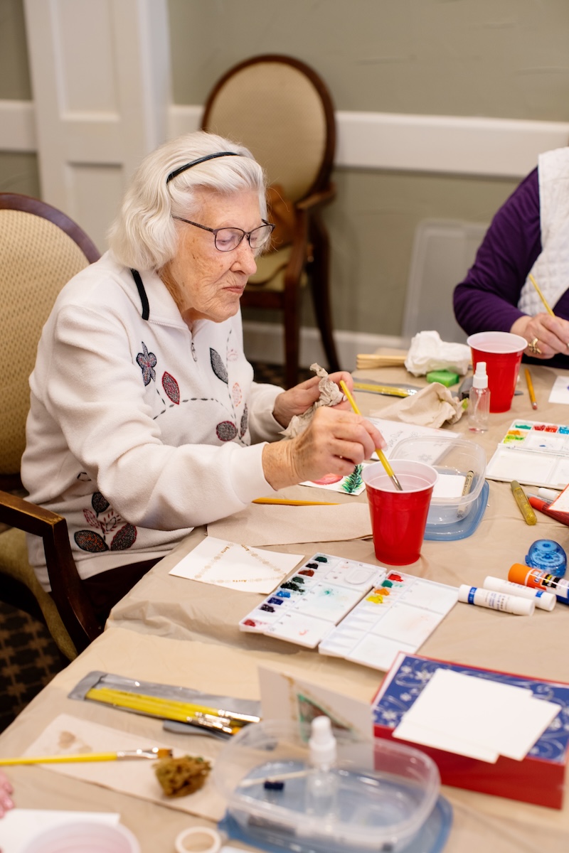 Senior women painting during a painting class