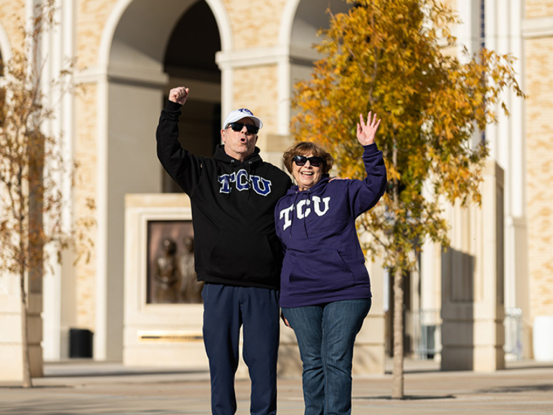 FWB-TCU-790x540 Older TCU alumni waving and cheering