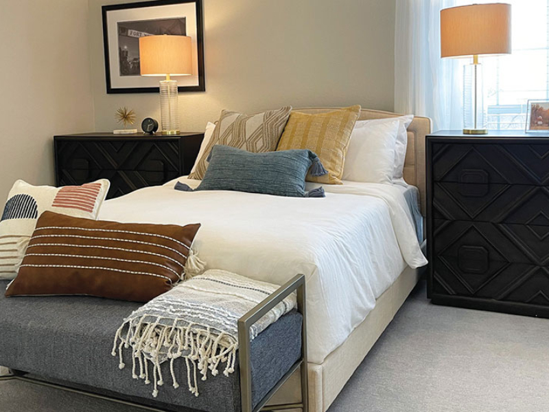 Homepage-Gallery-Bedroom Comfortable bed with decorative throw pillows