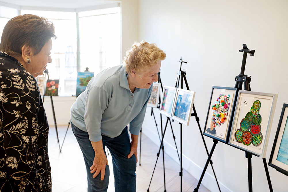 Signature-Experiences-Image Residents admiring paintings in the art gallery