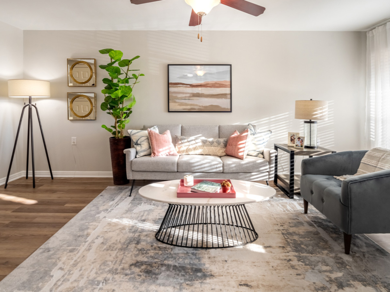 gallery-05-1400×900 large sunny living room with comfortable couches and decorative throw pillows