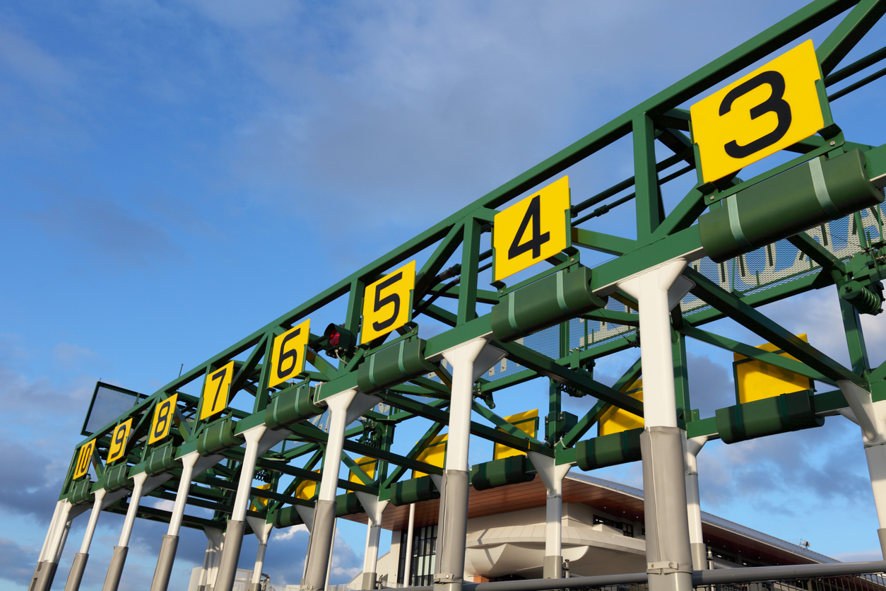Close up shot of an empty starting gate, waiting for the thoroughbreds to be loaded in and the beginning of the race.