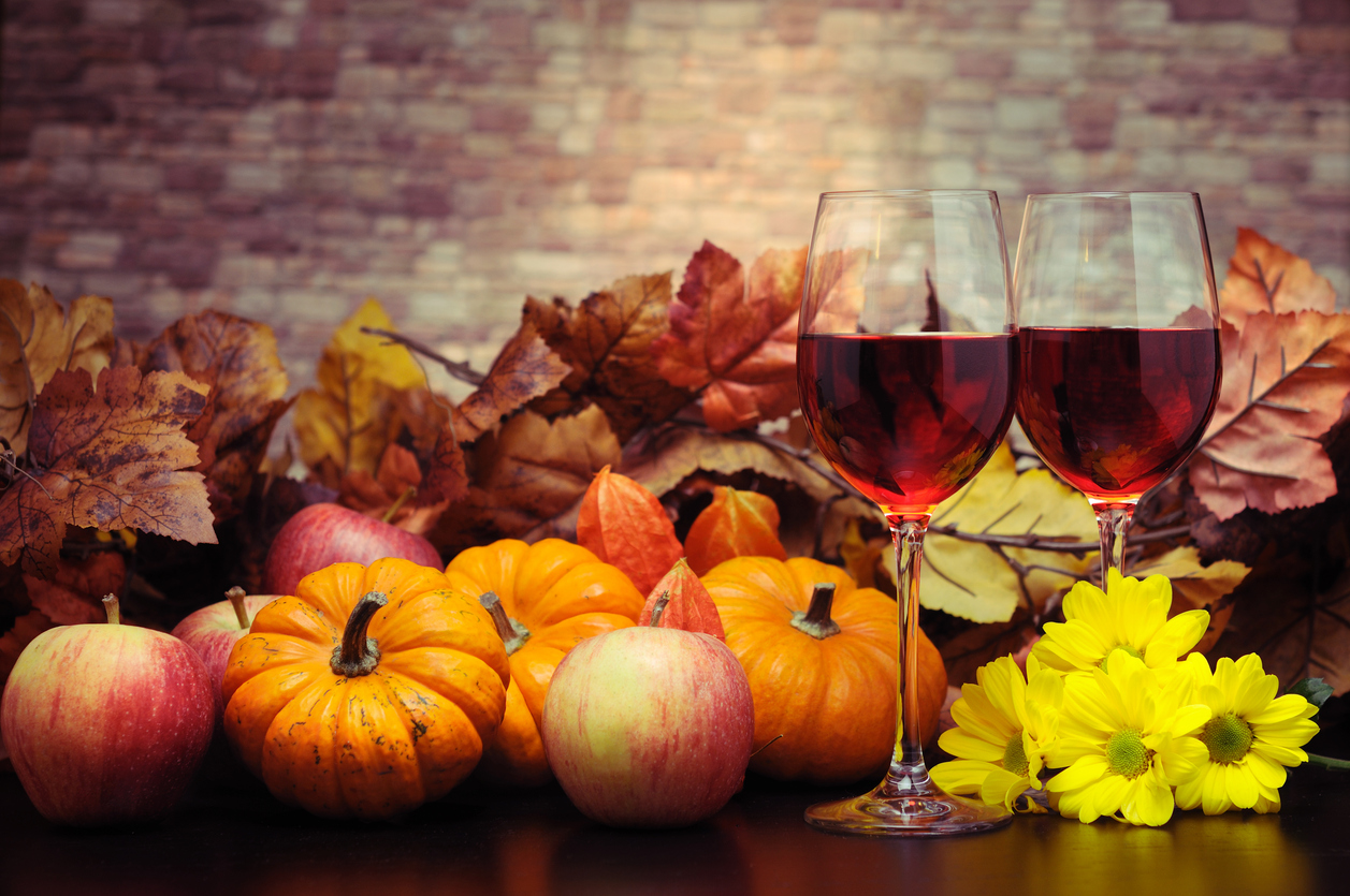 Red Wine with Autumn Decoration - toned image - selective focus