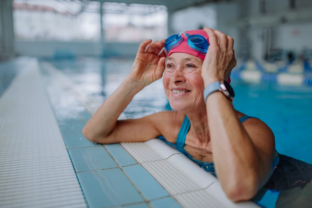 Smiling senior woman in indoor pool