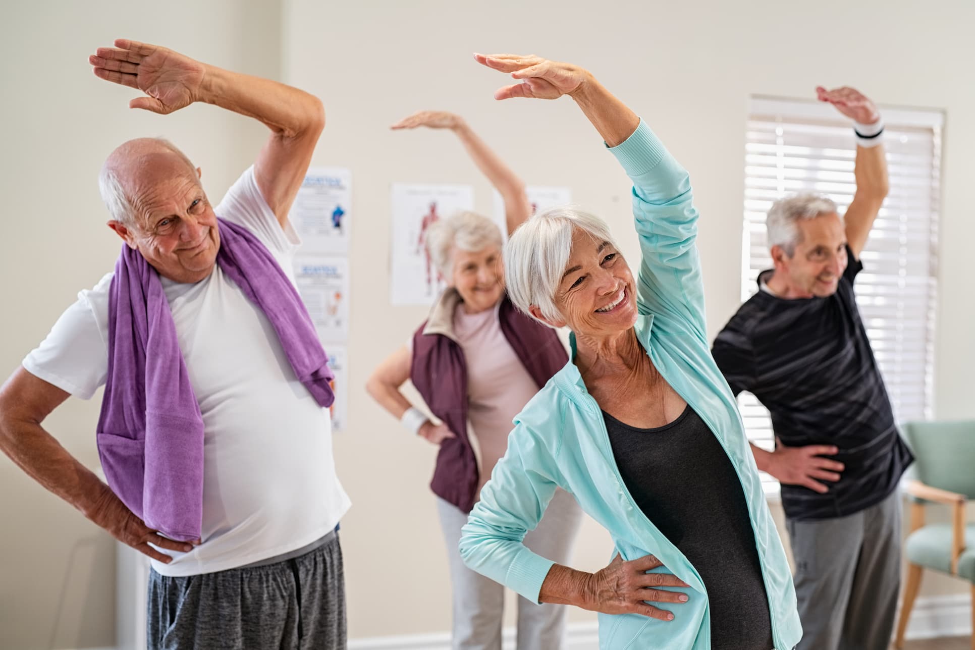 group of seniors stretching in exercise class