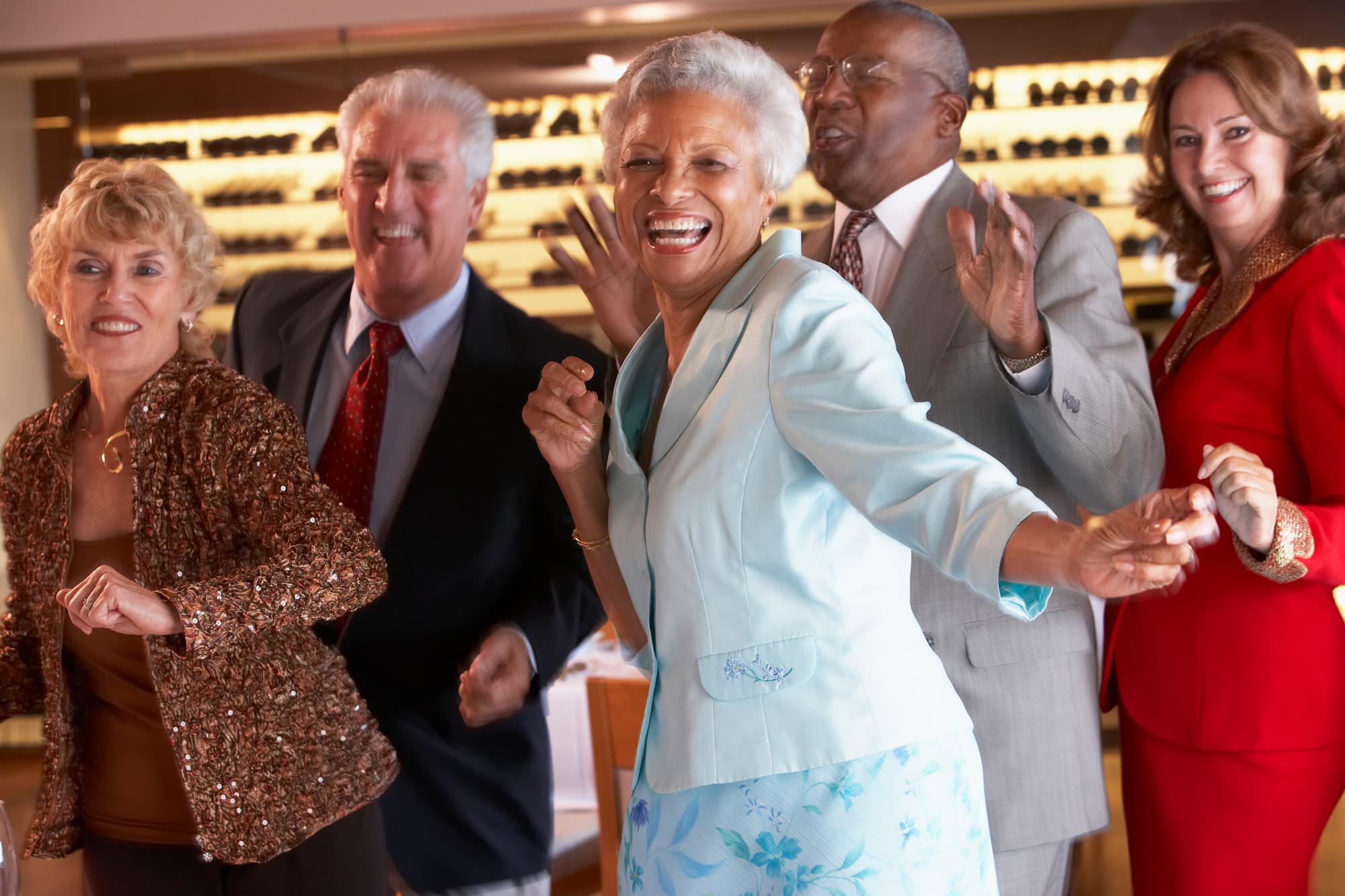Lively 1950s Themed Dance Seniors joyfully dancing at a 1950s sock hop themed event in a community space.